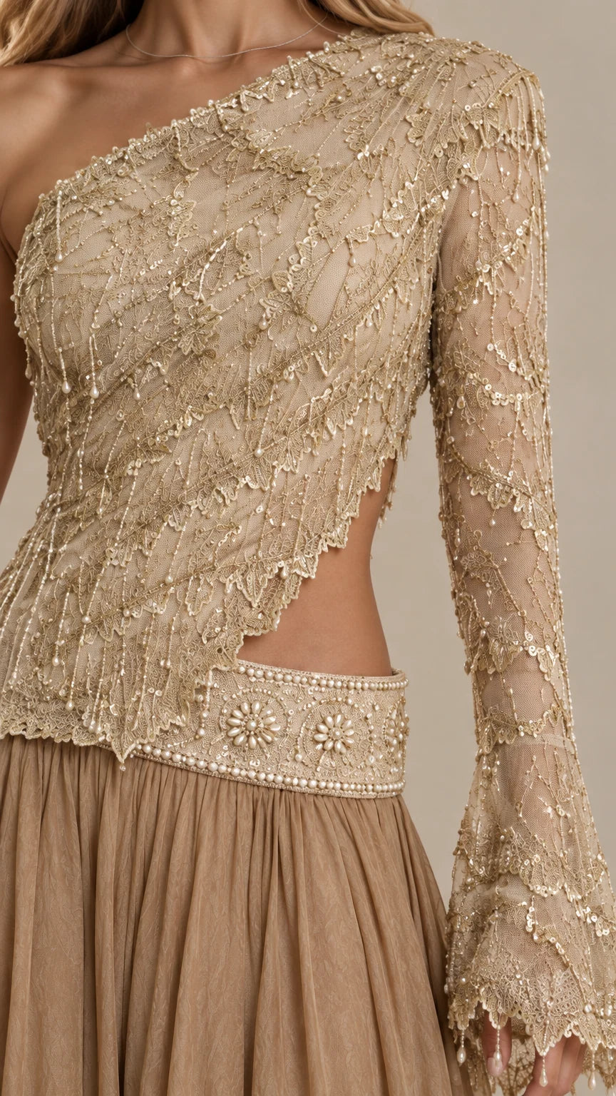 Detailed close-up of intricate beading and waist cutout on Champagne Gold gown