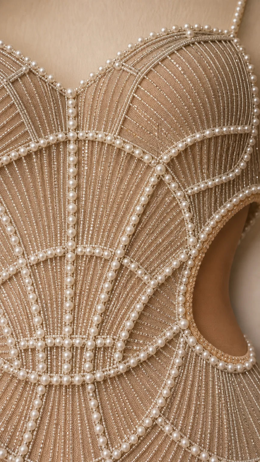 Close-up detail of sweetheart neckline with scalloped pearl and bead embroidery
