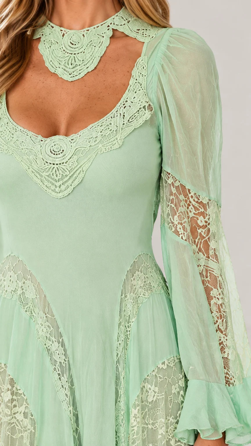 Close-up detail of lace choker collar, sweetheart cutout, and sheer sleeves