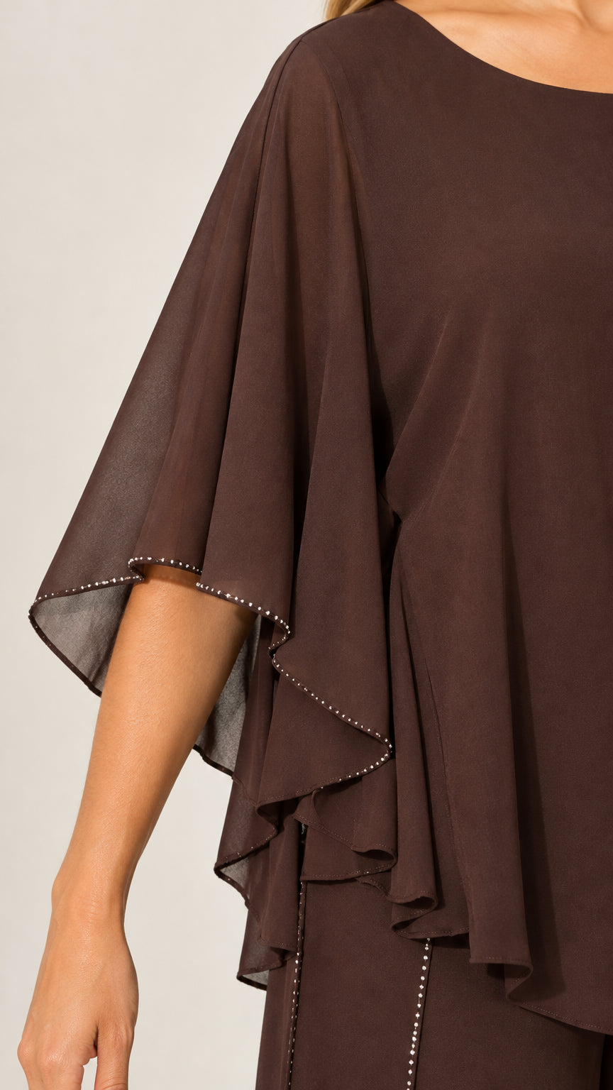 Close-up detail of tiered flutter sleeves and delicate beaded rhinestone trim on chiffon fabric