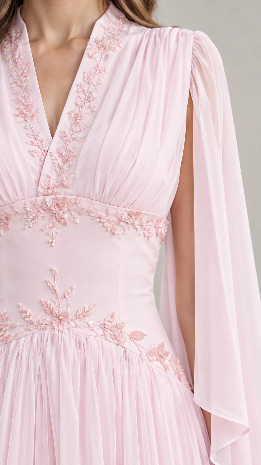 Close-up detail of bodice embroidery and V-neckline on Light Pink formal gown