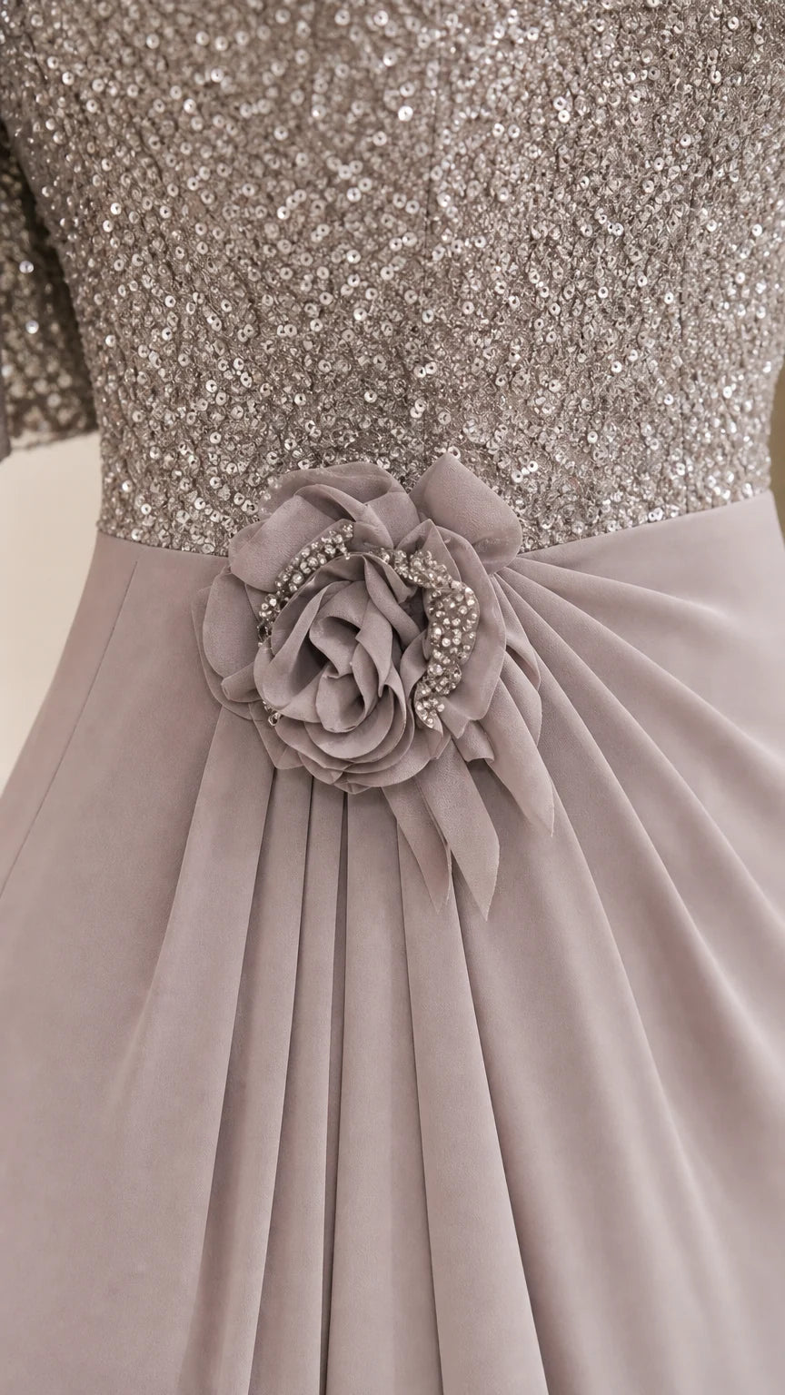 Close-up of sequin bodice and floral waist detail