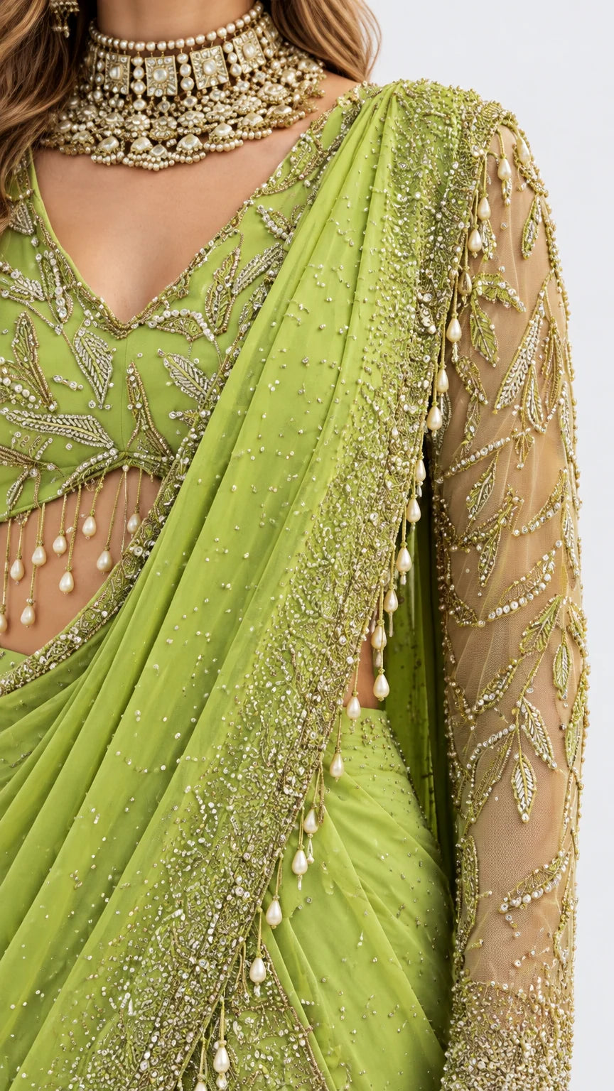 Close-up detail of beaded V-neckline, hanging bead fringe, and embroidered drape in lime green