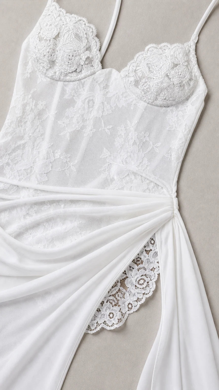 Close-up detail of white lace corset bodice and draped thigh slit accent