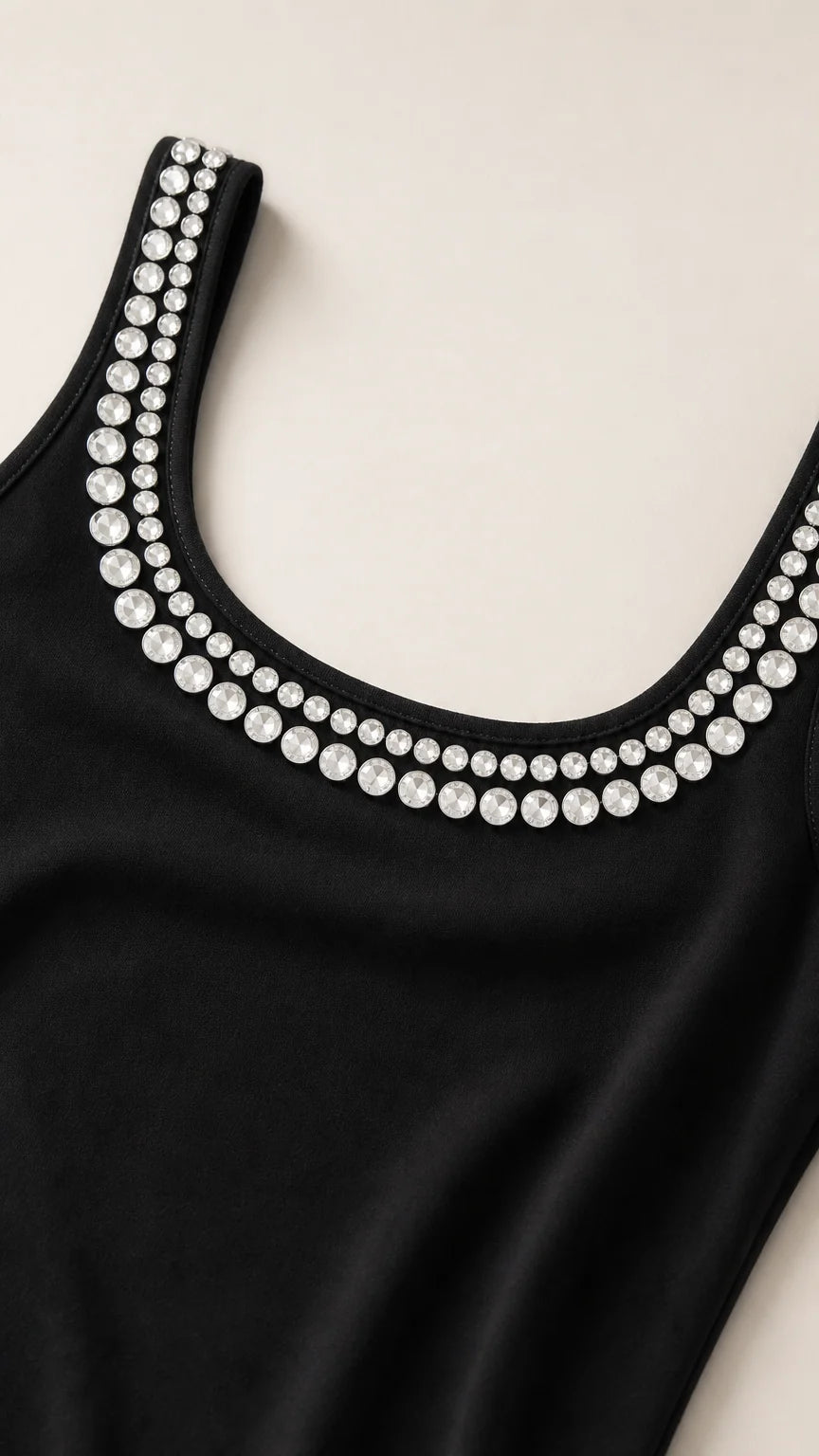 Close-up detail of sparkling crystal rhinestone trim on scoop neckline
