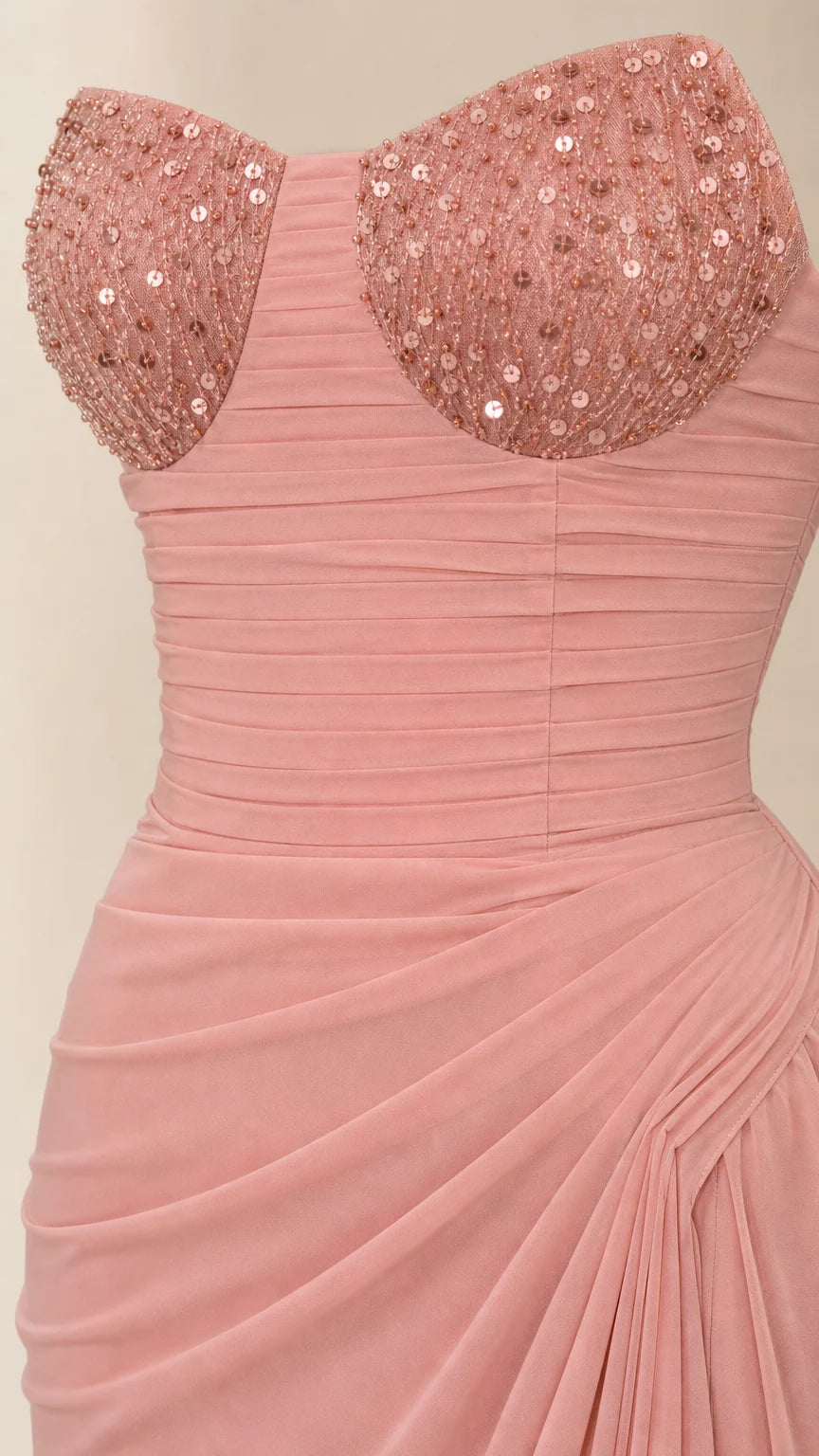 Close-up detail of sequined sweetheart cups and finely ruched chiffon bodice