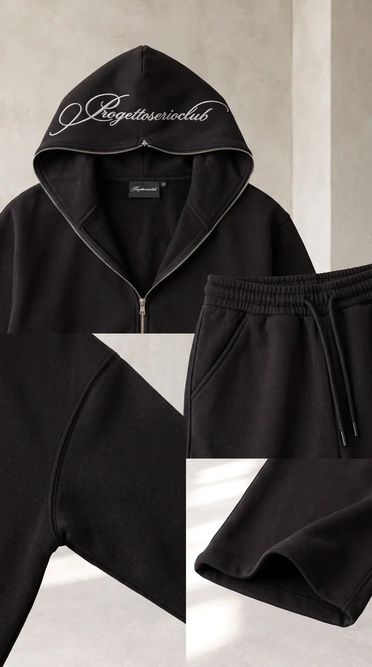 Close up details of black hoodie neckline, pocket stitching, drawstring waist, and hem