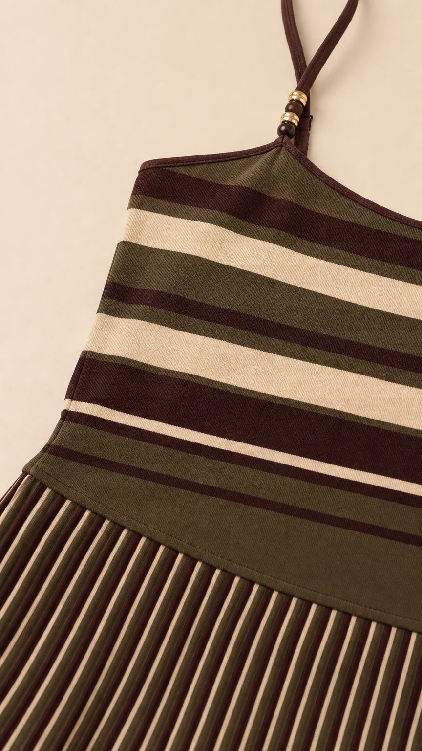 Close-up detail of knit fabric stripes and beaded shoulder strap