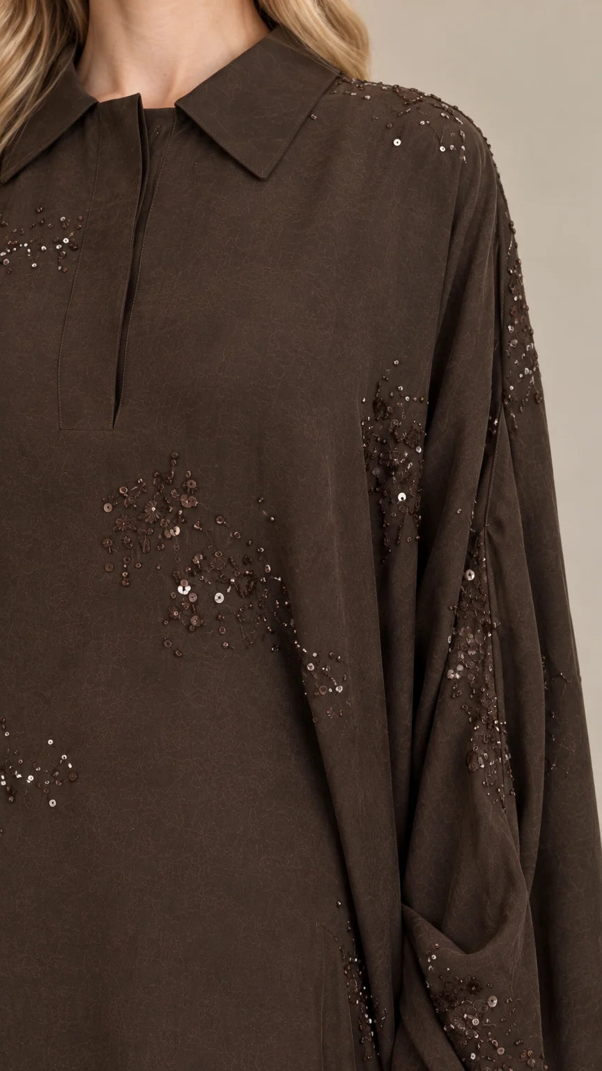 Close-up of Dark Brown kaftan collar, placket, and sequin embellishments