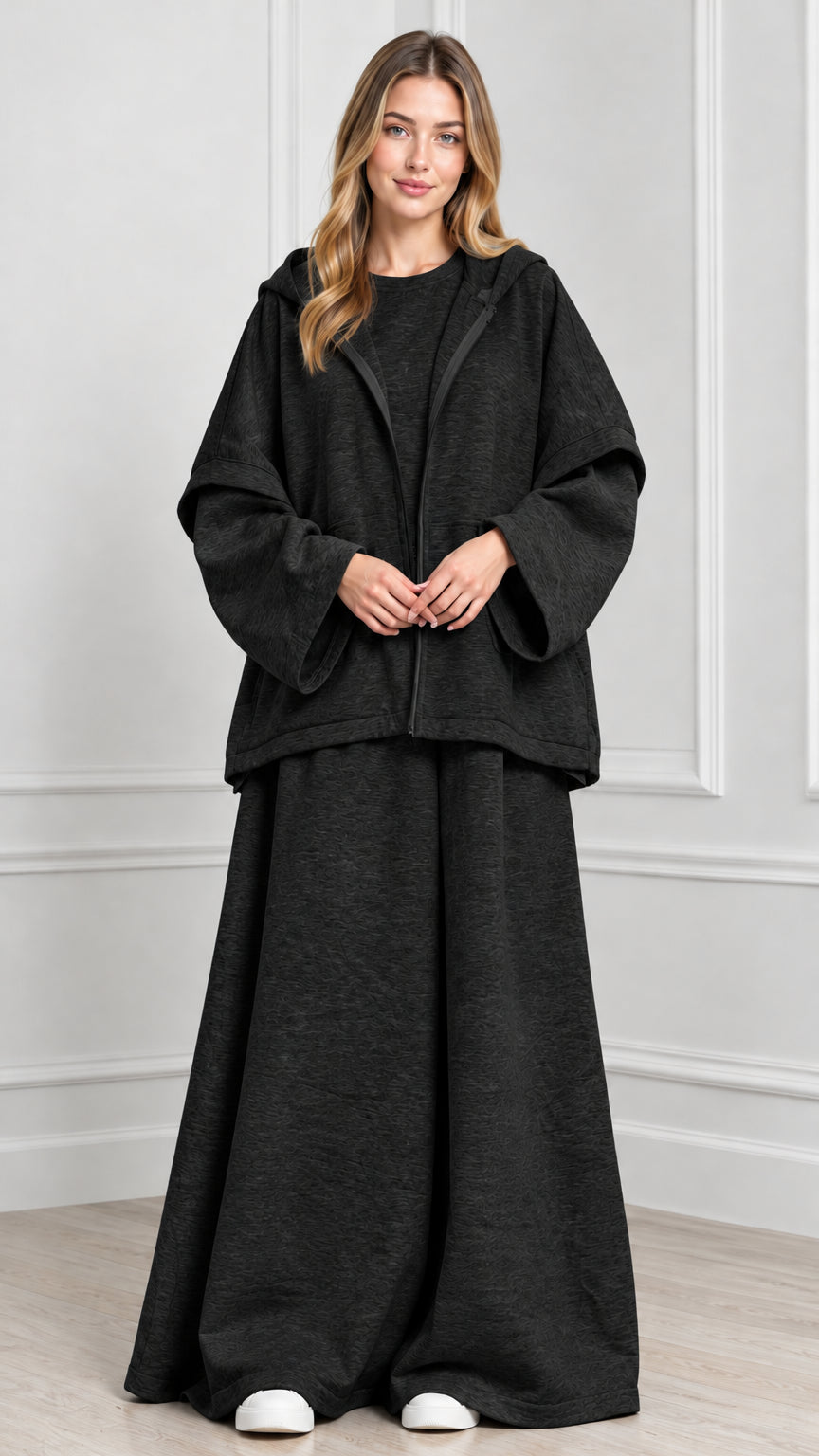 Front view of woman wearing Charcoal hooded cape jacket and wide-leg pants set