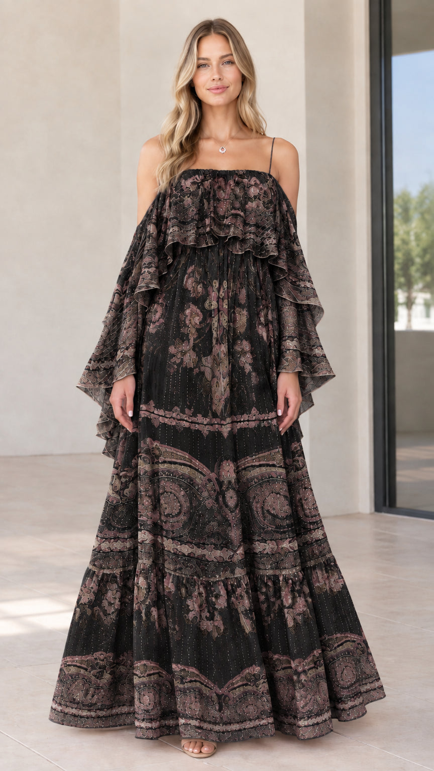 Full-length view of woman in black and brown paisley tiered cold-shoulder maxi dress