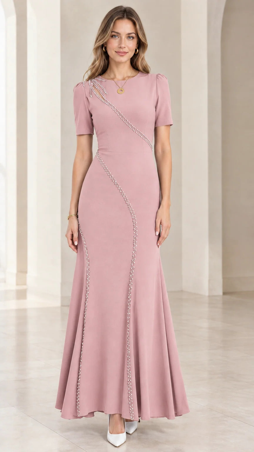 Front full-length view of dusty pink beaded cutout mermaid maxi gown