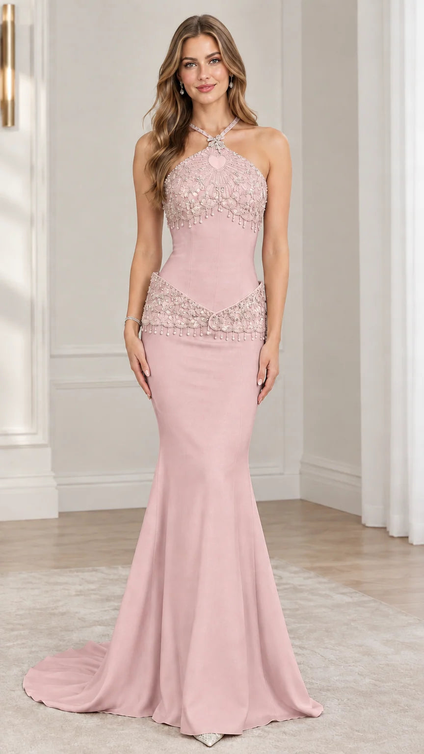 Front view of model wearing blush pink halter beaded mermaid evening gown