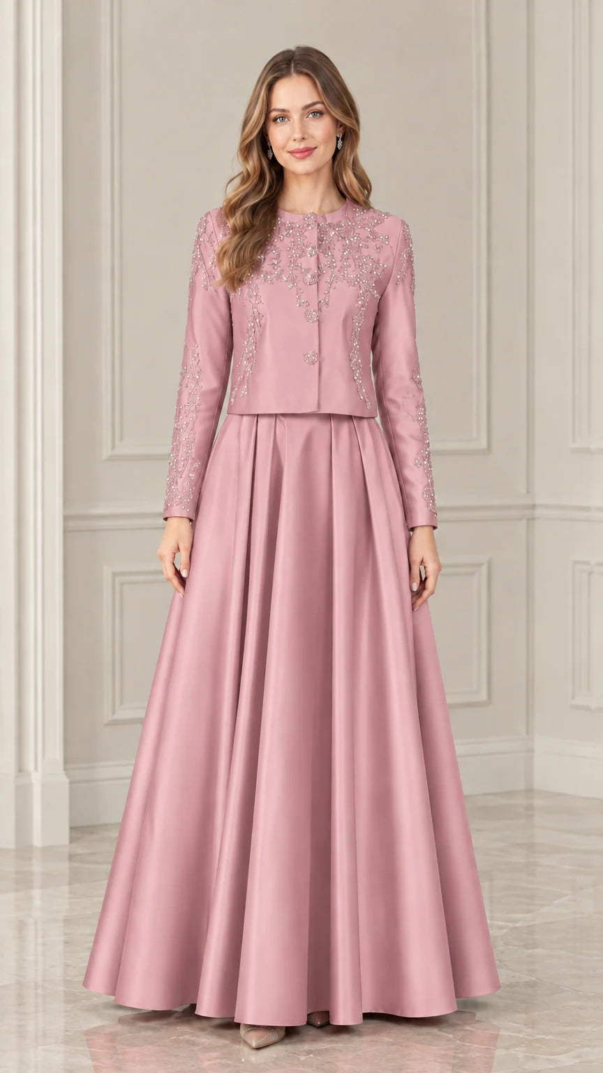 Model wearing dusty rose long sleeve beaded formal jacket and maxi skirt set