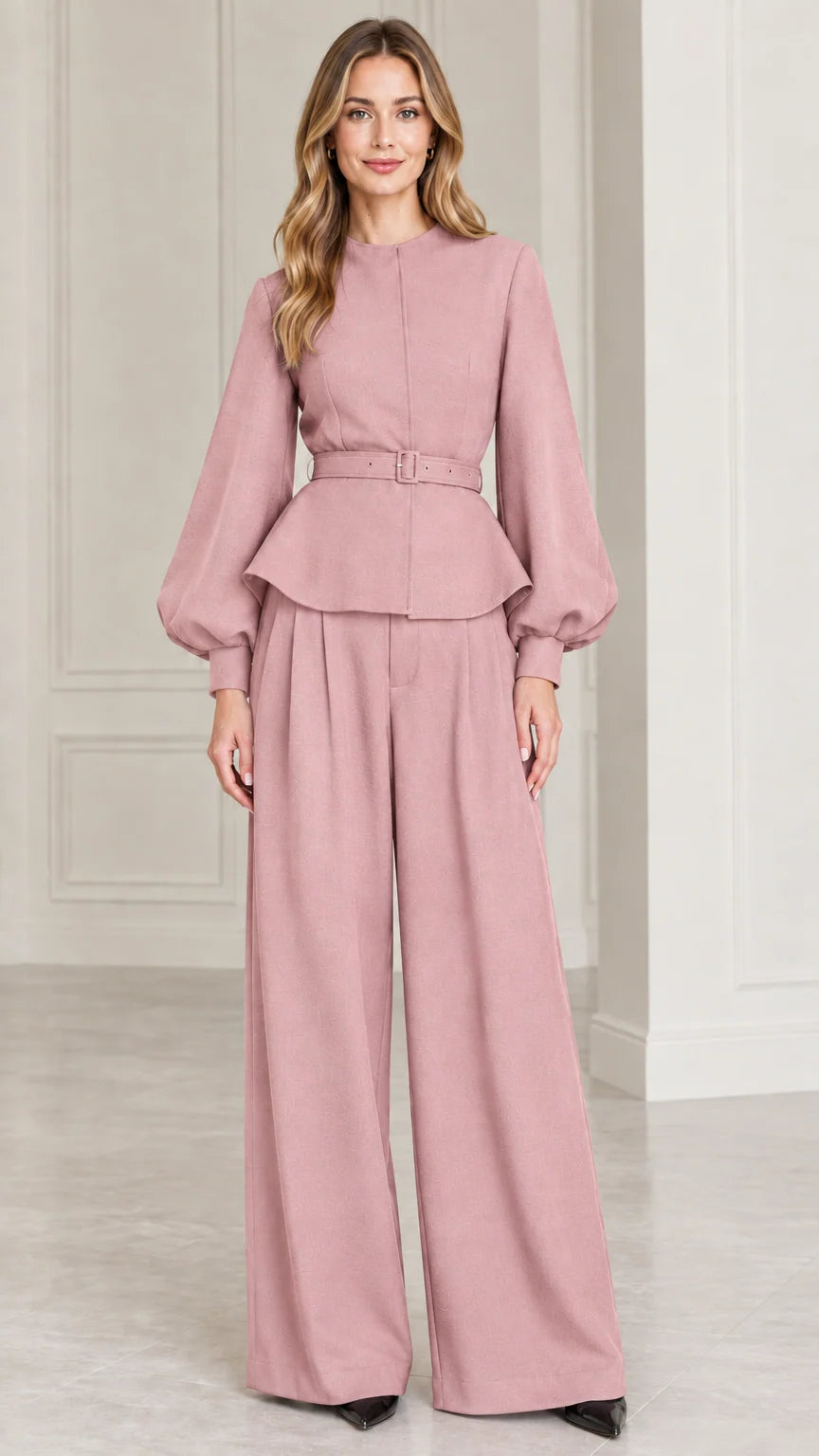 Full-length studio shot of model wearing Dusty Rose belted peplum top and wide-leg pants set