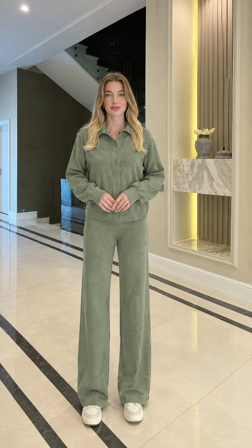 Full body studio shot of woman in sage green collared zip-up two-piece matching set