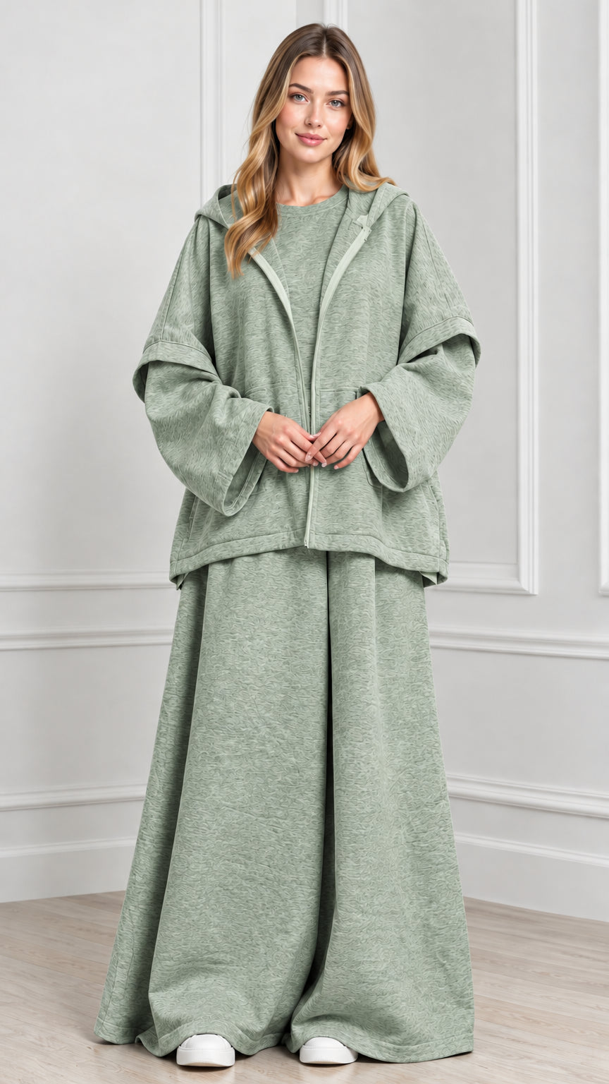 Front view of woman wearing Sage Green hooded cape jacket and wide-leg pants set