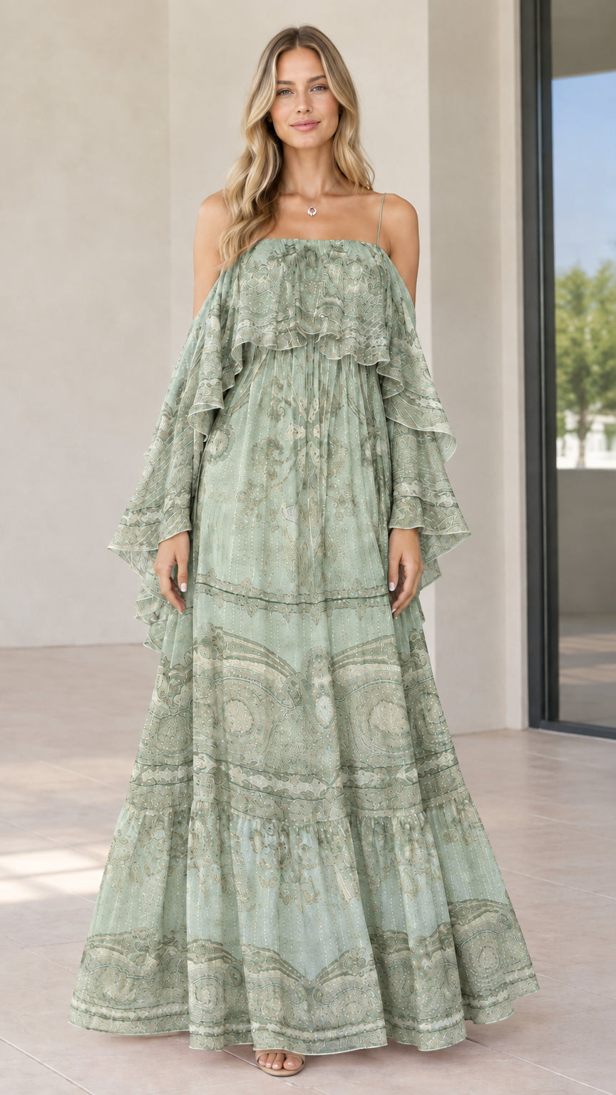 Full-length view of woman in sage green paisley tiered cold-shoulder maxi dress