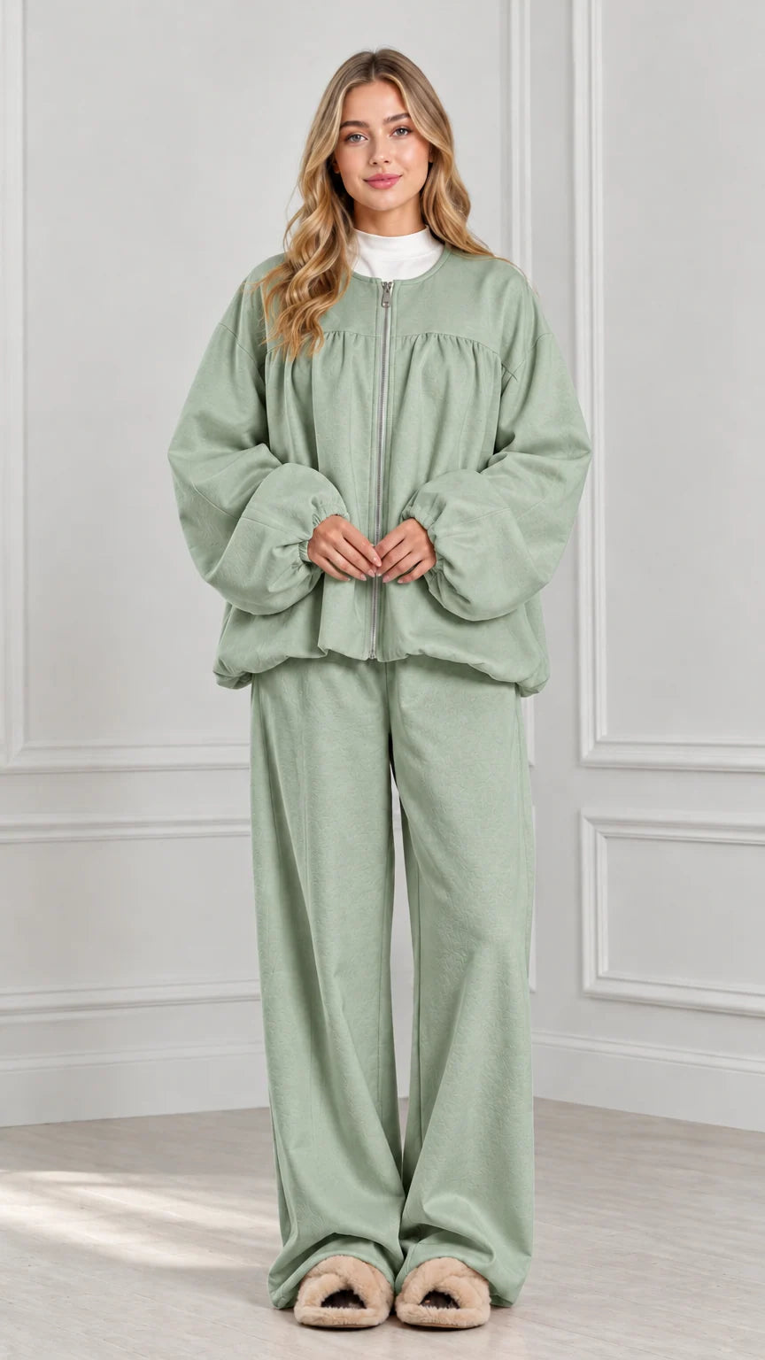 Full-body view of sage green two-piece zip jacket and wide-leg lounge set