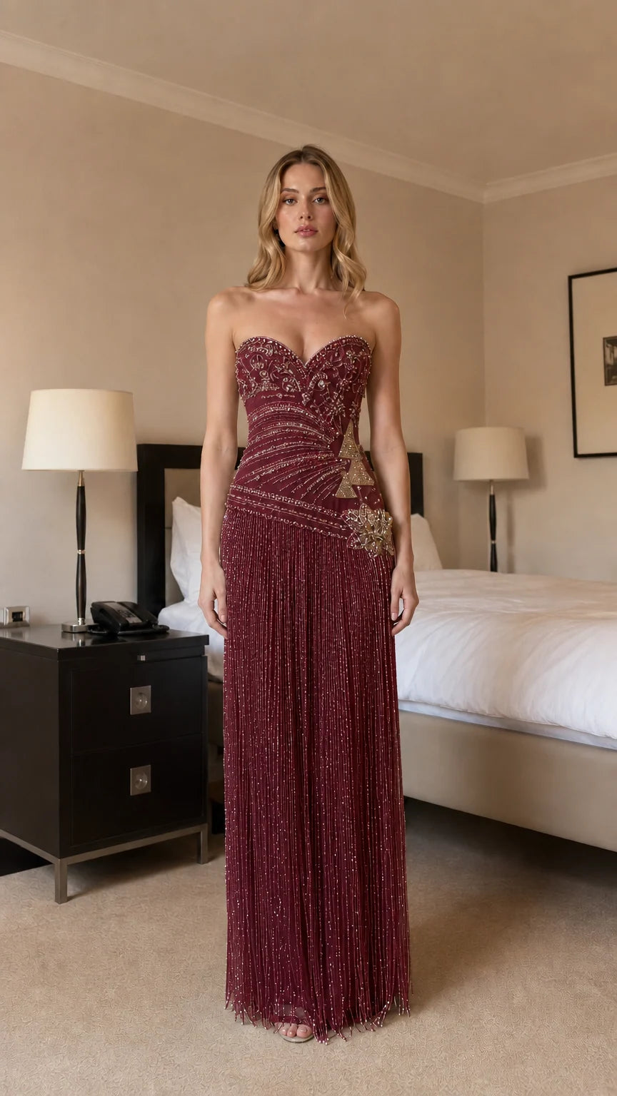 Front view of burgundy beaded strapless evening dress