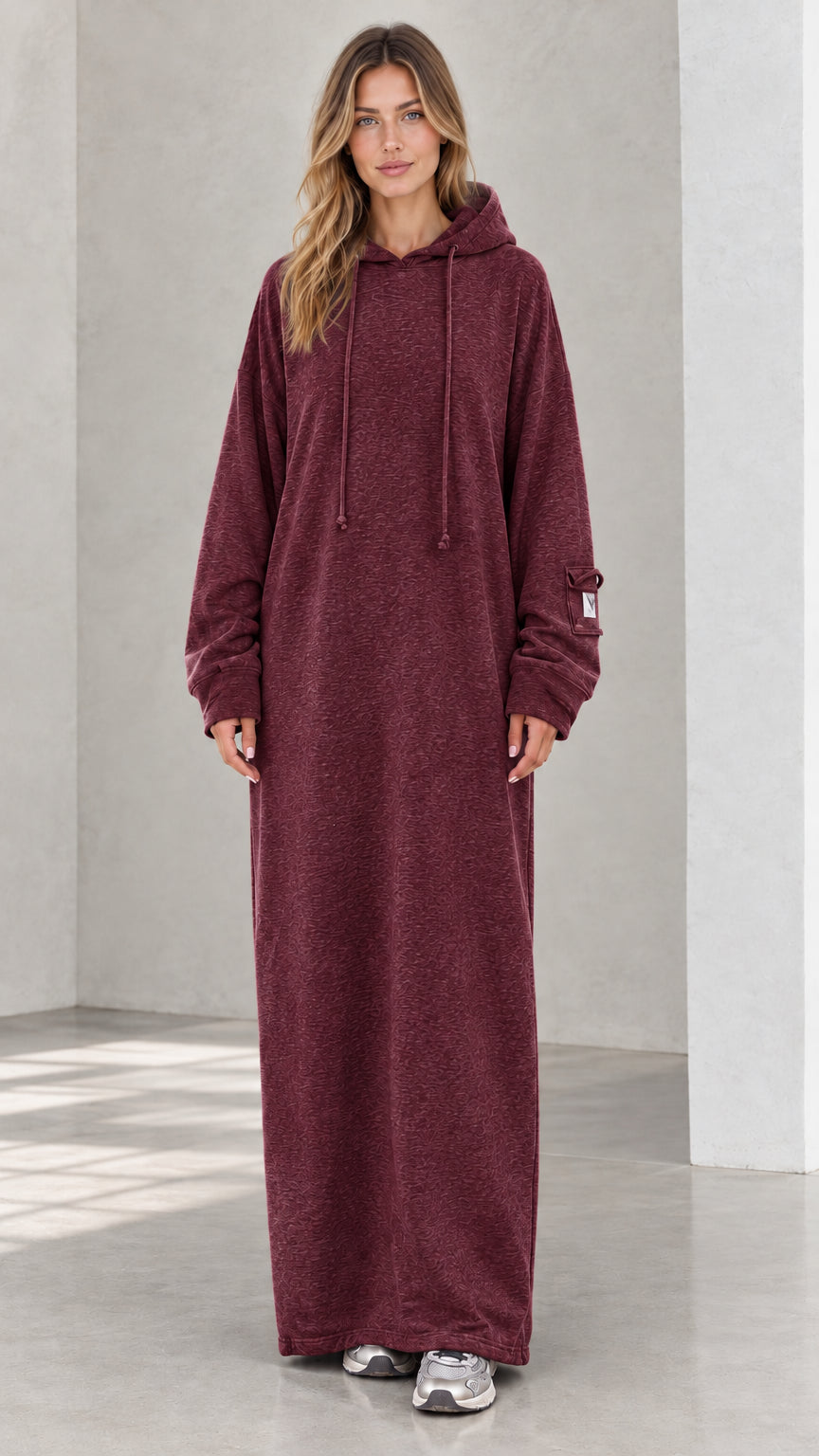 Front view of model wearing burgundy wine oversized maxi hoodie dress
