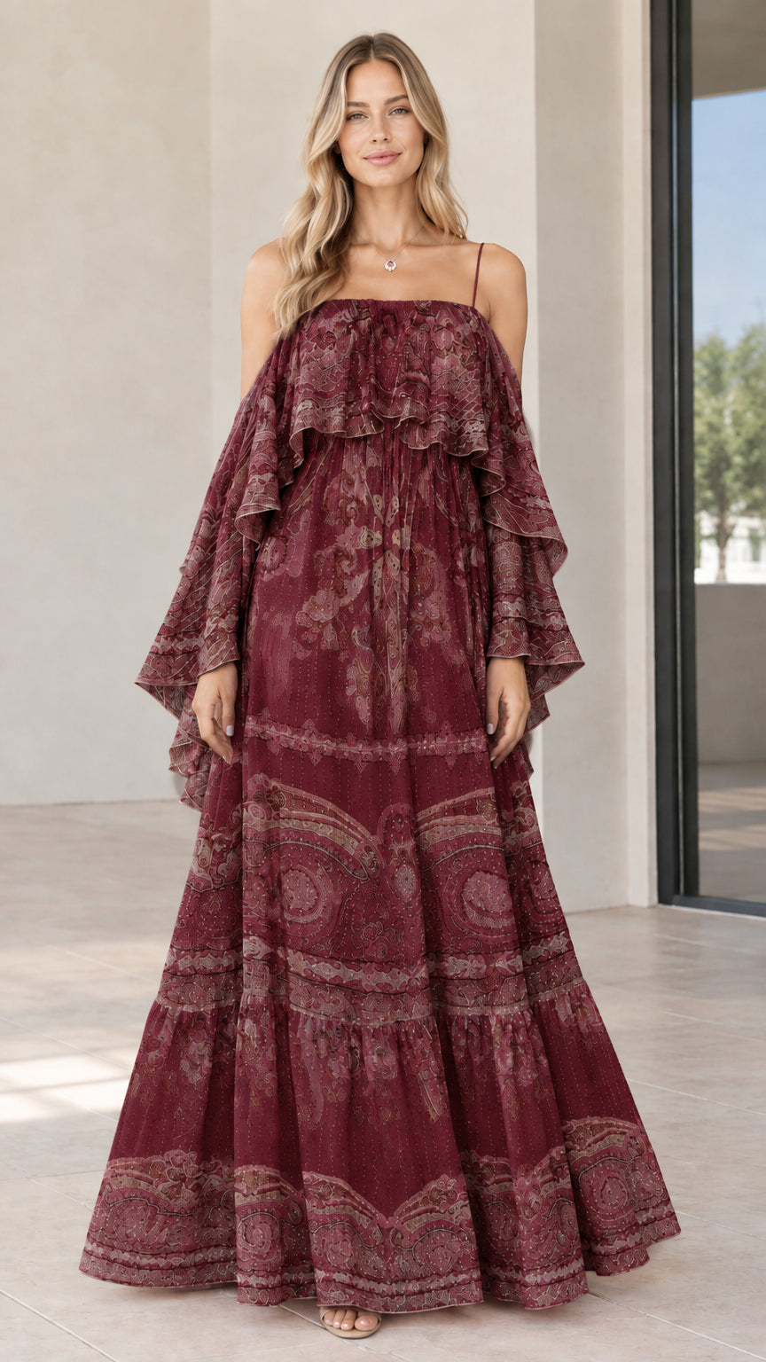 Full-length view of woman in burgundy wine paisley tiered cold-shoulder maxi dress