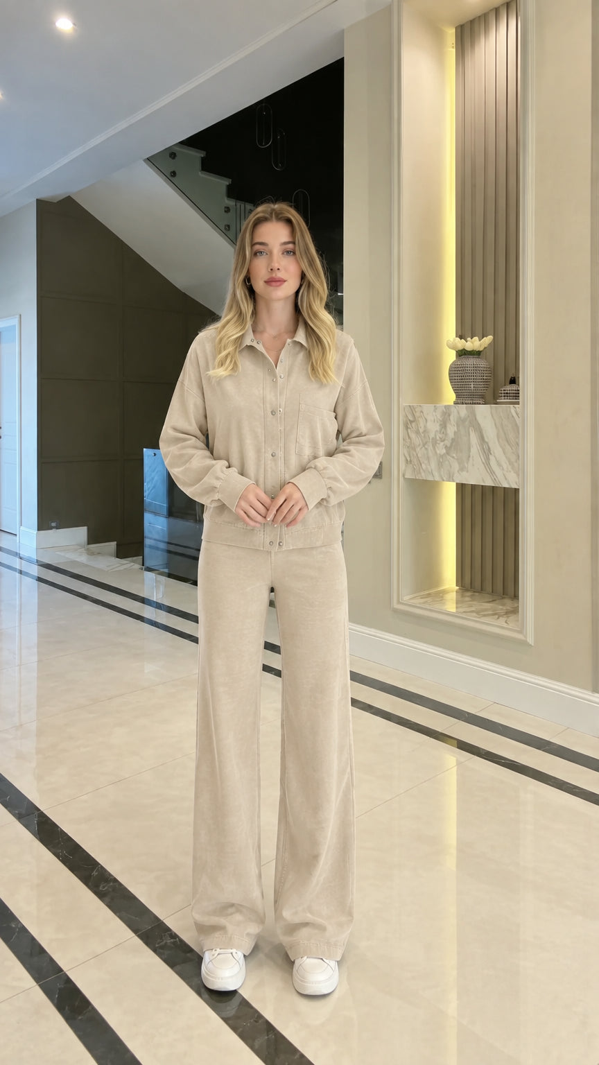 Full body studio shot of woman in beige cream collared zip-up matching lounge set