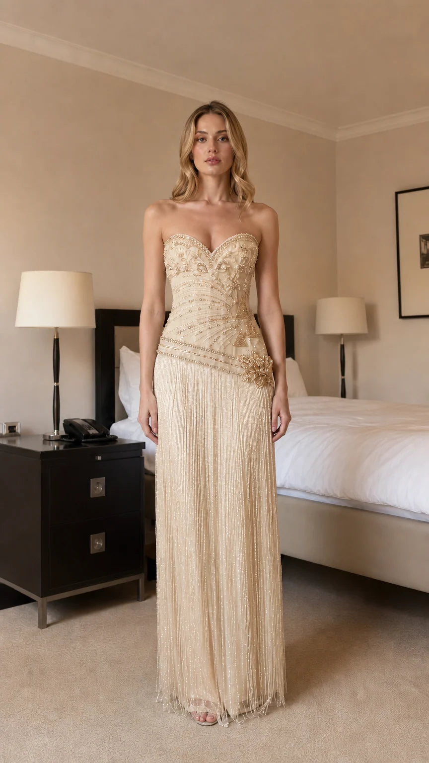 Front view of champagne beaded strapless evening dress