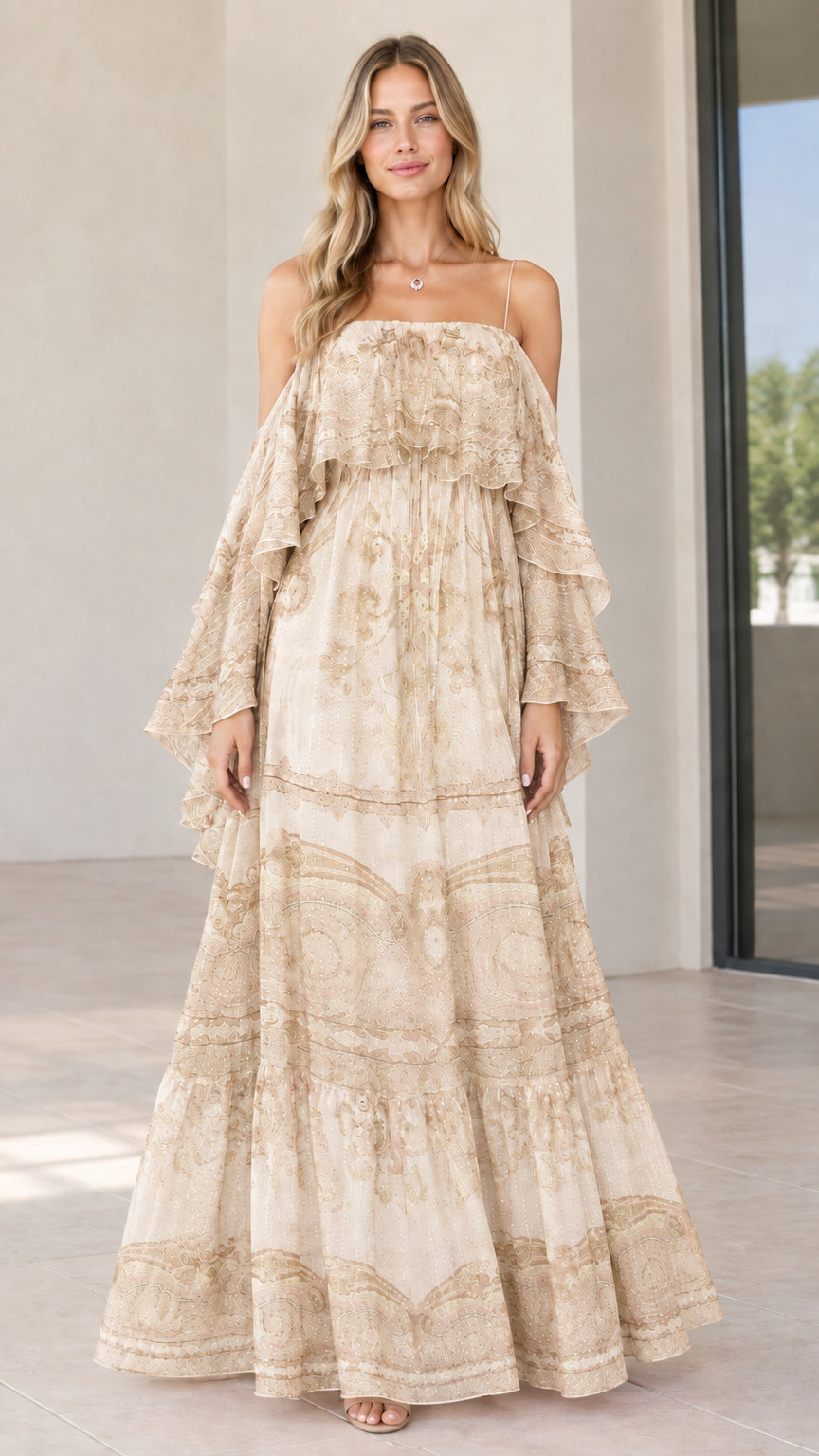 Full-length view of woman in beige cream paisley tiered cold-shoulder maxi dress