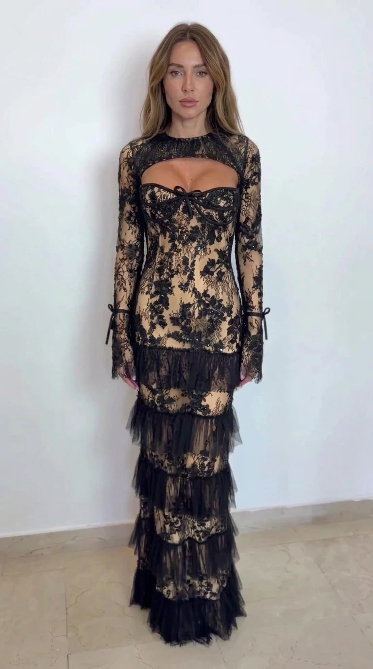 Model wearing black lace tiered maxi dress with champagne gold lining