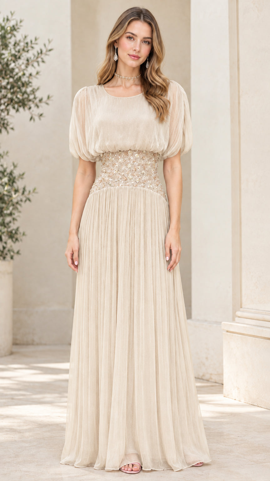 Front view of champagne beige pleated chiffon maxi dress with floral beadwork